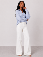 NOELIA | Elegante blusa a rayas con puños finos