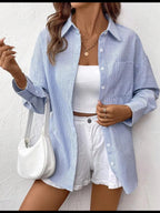 NOELIA | Elegante blusa a rayas con puños finos