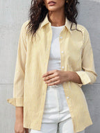 NOELIA | Elegante blusa a rayas con puños finos