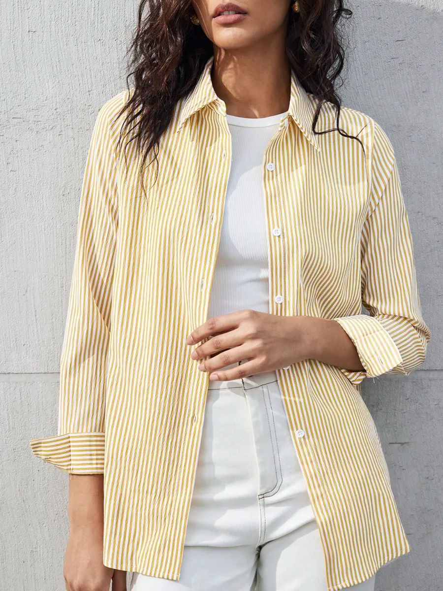 NOELIA | Elegante blusa a rayas con puños finos