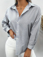 NOELIA | Elegante blusa a rayas con puños finos