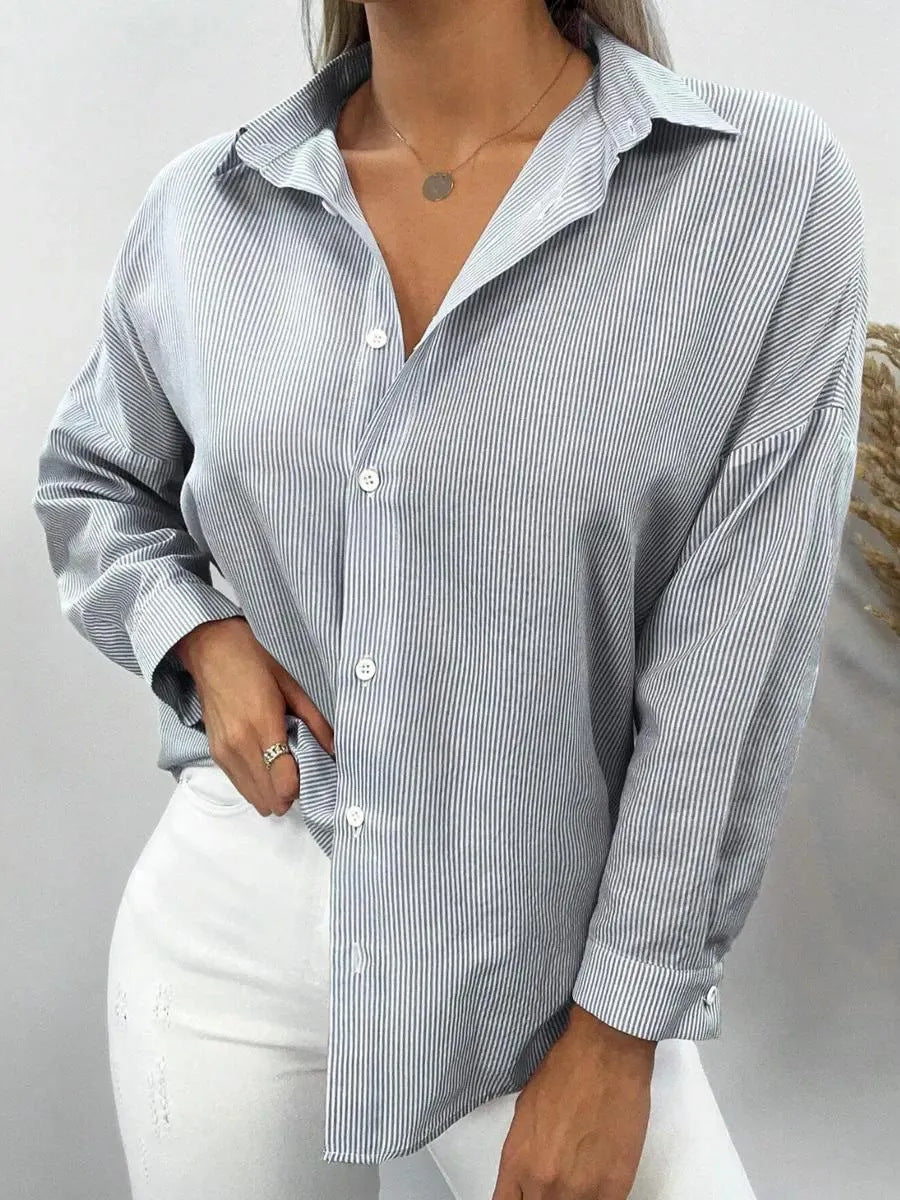NOELIA | Elegante blusa a rayas con puños finos